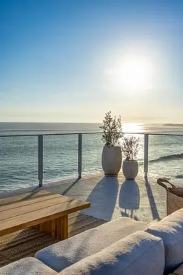 a living room with a view of the ocean at Aqualina Best View in Malibu by Stay Awhile Villas in Malibu