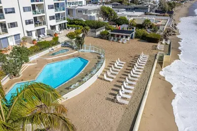 an aerial view of a swimming pool and beach at Aqualina Best View in Malibu by Stay Awhile Villas in Malibu