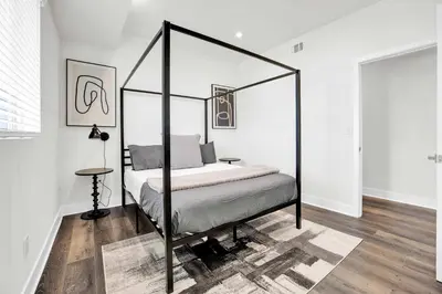 a bedroom with a canopy bed in a room at Spectacular Rooftop View House in Los Angeles