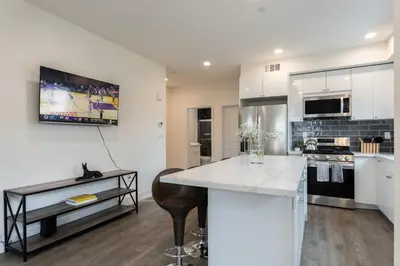 a kitchen with white cabinets and a counter top at Stylish DTLA Home With Views in Los Angeles