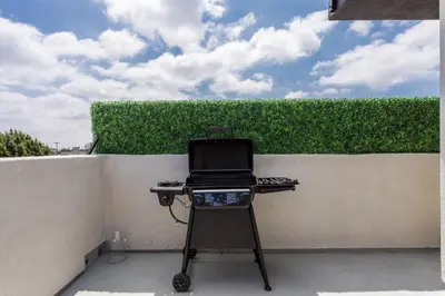 a barbecue grill in front of a wall at Stylish DTLA Home With Views in Los Angeles