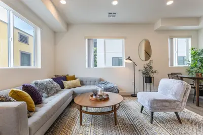 a living room with a couch and a table and chairs at Stylish DTLA Home With Views in Los Angeles
