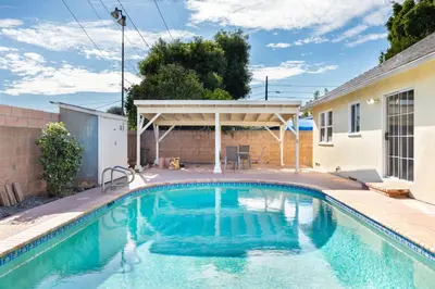 a swimming pool in the backyard of a house at Valley Ranch With Pool in Los Angeles