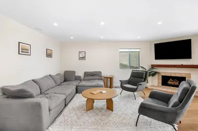 a living room with a couch and two chairs and a table at Venice Beach Villa in Los Angeles