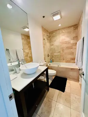 a bathroom with a sink and a toilet and a tub at Cool Apartment in West Hollywood in Los Angeles