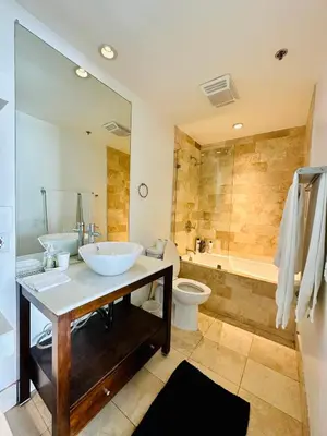 a bathroom with two sinks and a tub and a toilet at Cool Apartment in West Hollywood in Los Angeles