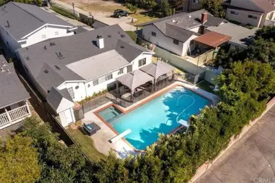 an overhead view of a house with a swimming pool at New Charming Spacious Disneyland Pool Home in Garden Grove