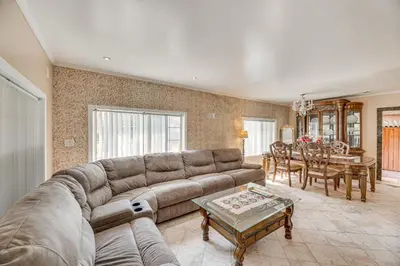 a living room with a couch and a table at Walk to Dtwn Shops! Extended Stay Home in Burbank in Burbank