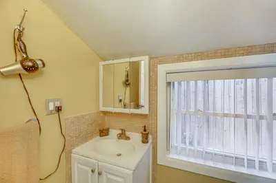 a bathroom with a sink and a window at Walk to Dtwn Shops! Extended Stay Home in Burbank in Burbank
