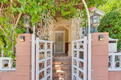 an entrance to a house with a white gate at Walk to Dtwn Shops! Extended Stay Home in Burbank in Burbank