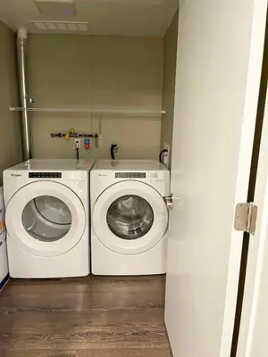 a laundry room with a washing machine and a washer at Glamorous Getaway in Hollywood in Los Angeles