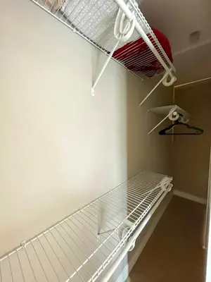 an empty closet with a rack and a shelf at Glamorous Getaway in Hollywood in Los Angeles