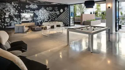 a living room with a foosball table in the middle at Glamorous Getaway in Hollywood in Los Angeles