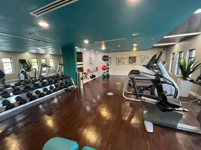 a gym with treadmills and elliptical machines at Cozy Apartment in Heart of Encino 104 in Encino