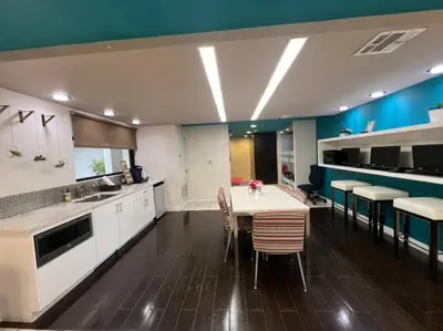 a kitchen with a table and chairs in a room at Cozy Apartment in Heart of Encino 104 in Encino