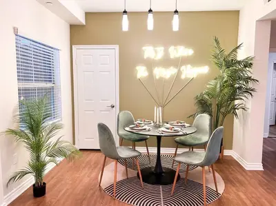 a dining room with a table and chairs at Cozy Apartment in Heart of Encino 104 in Encino
