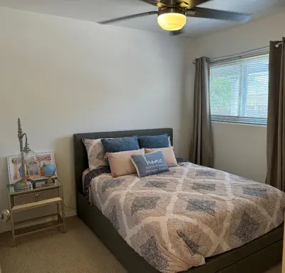 a bedroom with a bed and a ceiling fan at Emeric Ave in Simi Valley in Simi Valley
