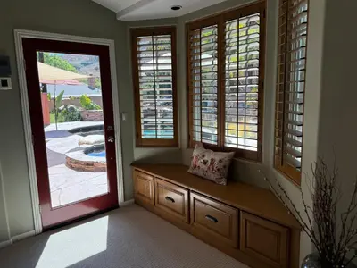 a porch with a bench next to a door at Emeric Ave in Simi Valley in Simi Valley