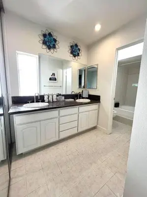 a large bathroom with two sinks and a tub at Family Paradise near Disneyland with Sparkling Pool in Del Prado Bolsa