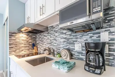 a kitchen with a sink and a microwave at Sunny Studio in the Heart of Venice Beach - #6 in Los Angeles