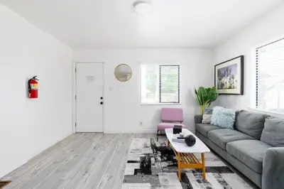 a living room with a couch and a table at Sunny 1 Bedroom in the Heart of Venice Beach - #1 in Los Angeles