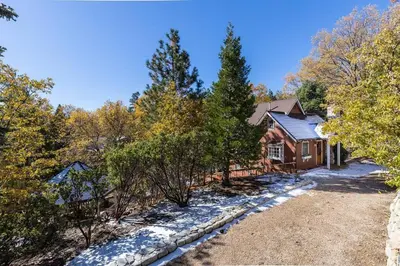 an aerial view of a house in the woods at Hideaway at Gingerbread Gardens in Twin Peaks