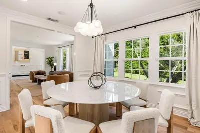 a dining room with a white table and chairs at Belmont Beverly Hills by Stay Awhile Villas in Los Angeles