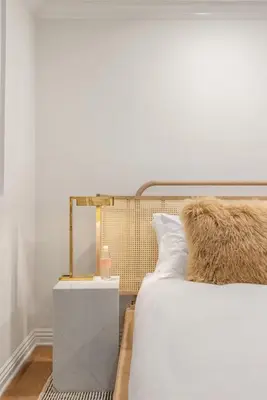 a bedroom with a bed with a nightstand and a bed sidx sidx sidx sidx at Belmont Beverly Hills by Stay Awhile Villas in Los Angeles