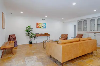 a living room with a couch and a table at Cozy Home with Pool and Jacuzzi Minutes from Universal Studios in Los Angeles