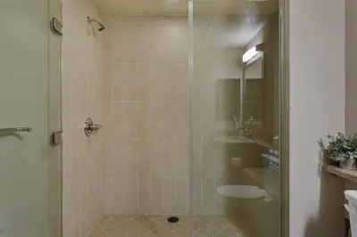 a bathroom with a shower with a glass door at Charming 1BD with Pool and Free Parking in Los Angeles