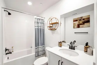 a bathroom with a sink and a toilet and a shower at Charming Home Near Six Flags in Santa Clarita