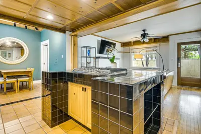 a kitchen with a large island in a room at Walk to Abbot Kinney Tranquil Cottage in Venice! in Los Angeles