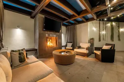 a living room with a couch and a fireplace at West Hollywood Hills Jacuzzi and Beautiful View in Los Angeles