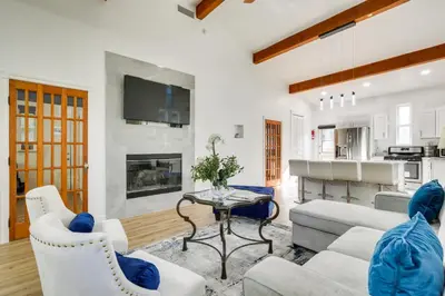 a living room with a couch and a table at Lake Arrowhead Hideaway with Deck and Hot Tub in Lake Arrowhead