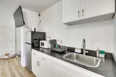 a kitchen with a sink and a refrigerator at 2 Mi to Water Lake Arrowhead Studio in Lake Arrowhead