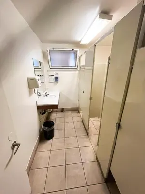 a small bathroom with a sink and a mirror at Van Nuys Homes for the Soul in Los Angeles
