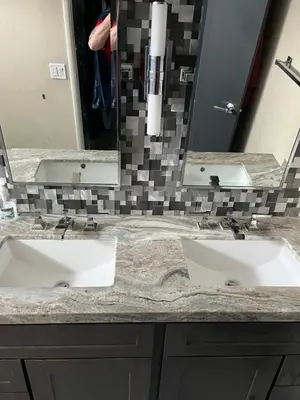 a bathroom with two sinks and a large mirror at Van Nuys Homes for the Soul in Los Angeles