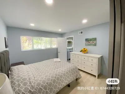 a bedroom with a bed and a dresser and a window at Home sweet home in Rowland Heights