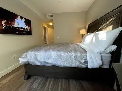 a bedroom with a large bed with white pillows at Cozy 2 Bedroom 2 Bathroom Condo with Pool, Gym, Spa in Los Angeles