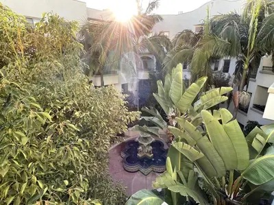 a garden with a fountain in the middle of a building at Cozy 2 Bedroom 2 Bathroom Condo with Pool, Gym, Spa in Los Angeles