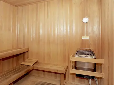 a sauna with a stove in a wooden wall at Cozy 2 Bedroom 2 Bathroom Condo with Pool, Gym, Spa in Los Angeles