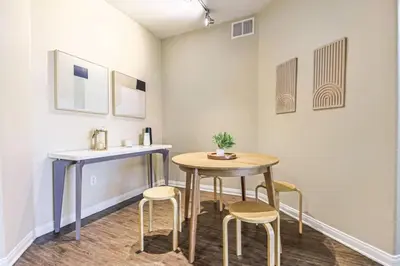 a table and stools in a room with a table and chairs at Marina del Rey 2BR - Near LAX, Beach & Dining in Los Angeles