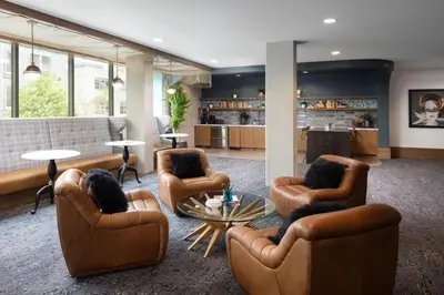 a lobby with couches and chairs and a table at Blueground Long Beach pool gym nr groceries LAX-1256 in Los Angeles