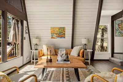 a living room with a couch and a table at Larks Nest in Big Bear Lake in Big Bear Lake