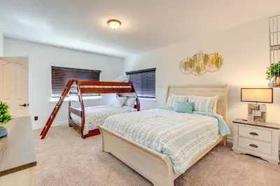 a bedroom with a bed and a bunk bed at Hesperia Home Near Mojave River and Hiking Trails! in Hesperia