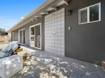 a house with a couch sitting outside of it at Retreat with Pool in Los Angeles