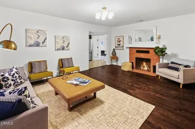 a living room with a couch and a fireplace at Glendale Hills Hideaway in Glendale