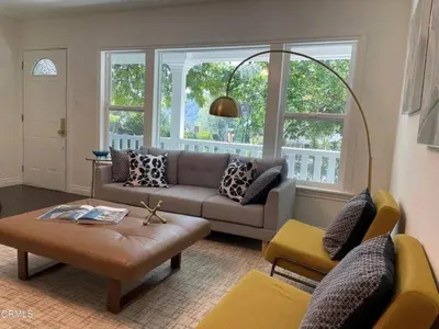 a living room with a couch and a table at Glendale Hills Hideaway in Glendale