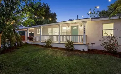a house with a porch and a yard at Glendale Hills Hideaway in Glendale