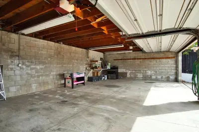 an empty garage with a brick wall at Ventura Downtown Minutes to Beaches in Ventura